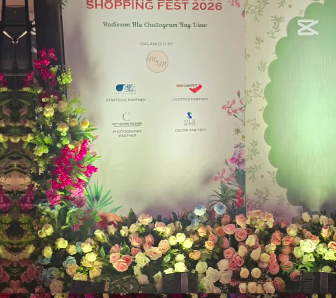 Eid Shopping Fest 2026 floral event backdrop and sponsor display at Radisson Blu